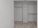 Spacious walk-in closet with ample shelving and rod space for organized storage at 100 Farris Ct, Raleigh, NC 27610