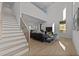 Bright, open-concept living room with tall ceilings, hardwood floors, and modern furnishings at 100 Farris Ct, Raleigh, NC 27610