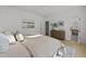 Comfortable bedroom featuring a plush bed, hardwood floors, and an ensuite bathroom at 100 Farris Ct, Raleigh, NC 27610