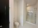 Bright bathroom features a toilet and glass-enclosed shower with dual shower heads at 1521 Havenmont Ct, Raleigh, NC 27608