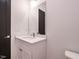 Modern bathroom featuring a vanity with a white countertop, sink, and faucet at 1521 Havenmont Ct, Raleigh, NC 27608