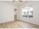Bright bedroom features hardwood floors and a large window offering lots of natural light at 1521 Havenmont Ct, Raleigh, NC 27608