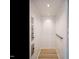 Bright elevator featuring modern recessed lights, a grab bar, and light wood flooring at 1521 Havenmont Ct, Raleigh, NC 27608