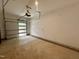 Spacious garage with ample room for parking and storage; featuring neutral walls and concrete flooring at 1521 Havenmont Ct, Raleigh, NC 27608