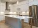 Stylish kitchen featuring stainless steel appliances, a central island, and bright white cabinets at 1521 Havenmont Ct, Raleigh, NC 27608