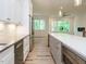 Gourmet kitchen features modern appliances, white cabinets, a large island, and an open layout at 1521 Havenmont Ct, Raleigh, NC 27608