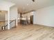 Spacious living space with hardwood floors flowing into the kitchen with an island and modern appliances at 1521 Havenmont Ct, Raleigh, NC 27608