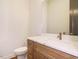 Bathroom features white countertop and sink with a wooden vanity and stylish gold faucet at 1523 Havenmont Ct, Raleigh, NC 27608