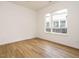 Bright bedroom with hardwood floors and a large window, offering a serene and inviting space at 1523 Havenmont Ct, Raleigh, NC 27608