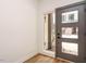 Modern foyer with natural light, a stylish door, and pristine white walls, creating an inviting space at 1523 Havenmont Ct, Raleigh, NC 27608