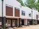 Modern townhome exterior featuring a striking facade, private entrances, and a sleek, contemporary design at 1523 Havenmont Ct, Raleigh, NC 27608
