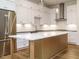 Gourmet kitchen with white cabinets, a large island, and stainless steel appliances, perfect for cooking at 1523 Havenmont Ct, Raleigh, NC 27608