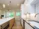 Spacious kitchen with an island, stainless steel appliances, and an open view to the living area at 1523 Havenmont Ct, Raleigh, NC 27608