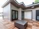Spacious rooftop deck features wood tile flooring and a contemporary fire pit, ideal for enjoying the outdoors at 1523 Havenmont Ct, Raleigh, NC 27608