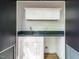 Convenient wet bar features white cabinets, a gray countertop, and a modern faucet, great for entertaining at 1523 Havenmont Ct, Raleigh, NC 27608