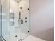 Modern bathroom featuring a glass shower with matte black hardware and white tile surround at 1525 Havenmont Ct, Raleigh, NC 27608
