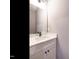 Powder room featuring a white vanity with quartz countertop and matte black hardware at 1525 Havenmont Ct, Raleigh, NC 27608