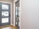 Modern entryway boasting wood flooring, a stylish front door, and gray interior doors at 1525 Havenmont Ct, Raleigh, NC 27608