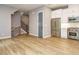 Open floor plan showcases the kitchen with stainless steel appliances and staircase at 1525 Havenmont Ct, Raleigh, NC 27608