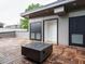 Stylish roof deck with modern fire pit, parquet-pattern wood decking and doors to interior space at 1525 Havenmont Ct, Raleigh, NC 27608