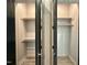 Open closet with shelving and clothes rods for storage at 1527 Havenmont Ct, Raleigh, NC 27608