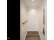 Clean elevator interior with wood flooring and silver handrail at 1527 Havenmont Ct, Raleigh, NC 27608