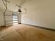 Empty garage with concrete floor, white walls, and automated garage door opener at 1527 Havenmont Ct, Raleigh, NC 27608