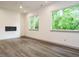 Living room with neutral walls, recessed lights and a ceiling fan at 1527 Havenmont Ct, Raleigh, NC 27608