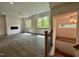 Bright living room featuring modern fireplace, ceiling fan, and natural light from large windows at 1527 Havenmont Ct, Raleigh, NC 27608