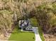 Aerial view showcasing the beautiful two-story home, surrounded by lush trees and a well-manicured lawn at 143 Hook Dr # 23, Fuquay Varina, NC 27526