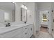 This bathroom features a double vanity with modern fixtures, mirrors and plenty of storage at 143 Hook Dr # 23, Fuquay Varina, NC 27526