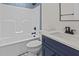 Modern bathroom with white vanity, bathtub, and blue tile at 143 Hook Dr # 23, Fuquay Varina, NC 27526