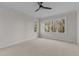 Bright bedroom featuring carpet, ceiling fan, and wooded views at 143 Hook Dr # 23, Fuquay Varina, NC 27526