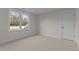 Simple bedroom with carpet and large window at 143 Hook Dr # 23, Fuquay Varina, NC 27526