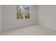 Bright bedroom with hardwood floors and a large window offering natural light at 143 Hook Dr # 23, Fuquay Varina, NC 27526