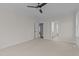 Spacious bedroom with carpet, ceiling fan and access to bathroom at 143 Hook Dr # 23, Fuquay Varina, NC 27526