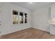 Bright dining area with hardwood floors and a view of the wooded backyard at 143 Hook Dr # 23, Fuquay Varina, NC 27526