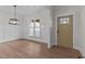 Bright dining room with hardwood floors and wainscoting at 143 Hook Dr # 23, Fuquay Varina, NC 27526