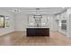 Modern kitchen with large island, white cabinets, and stainless steel appliances at 143 Hook Dr # 23, Fuquay Varina, NC 27526