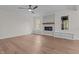 Open living space with hardwood floors and a fireplace at 143 Hook Dr # 23, Fuquay Varina, NC 27526