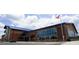 Brick building with large windows and a blue metal roof, landscaping and parking at 138 New Twin Branch Ct, Smithfield, NC 27577