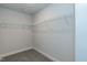 Walk-in closet with wire shelving and carpeted flooring for organized storage at 138 New Twin Branch Ct, Smithfield, NC 27577