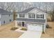 Lovely two-story home featuring stone accents, an attached two-car garage, and a welcoming entrance at 138 New Twin Branch Ct, Smithfield, NC 27577