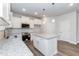 Well-lit kitchen featuring white cabinets, granite countertops, stainless steel appliances, and a central island at 138 New Twin Branch Ct, Smithfield, NC 27577