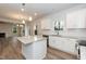 Modern kitchen with white cabinets, granite countertops, and stainless steel appliances at 138 New Twin Branch Ct, Smithfield, NC 27577