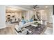 Bright, open-concept living room flows into the kitchen with modern decor and wood floors at 138 New Twin Branch Ct, Smithfield, NC 27577