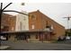 Exterior of a historic brick theater featuring a white art-deco facade and vintage signage at 138 New Twin Branch Ct, Smithfield, NC 27577