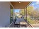 Relaxing balcony featuring a modern dining table, comfortable chairs, and a great neighborhood view at 600 N Roxboro St # 24, Durham, NC 27701