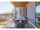 Inviting balcony featuring a modern dining table with seating and scenic neighborhood views at 600 N Roxboro St # 24, Durham, NC 27701