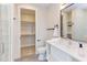 Modern bathroom featuring a sleek vanity, walk-in shower, and access to a spacious walk-in closet at 600 N Roxboro St # 24, Durham, NC 27701